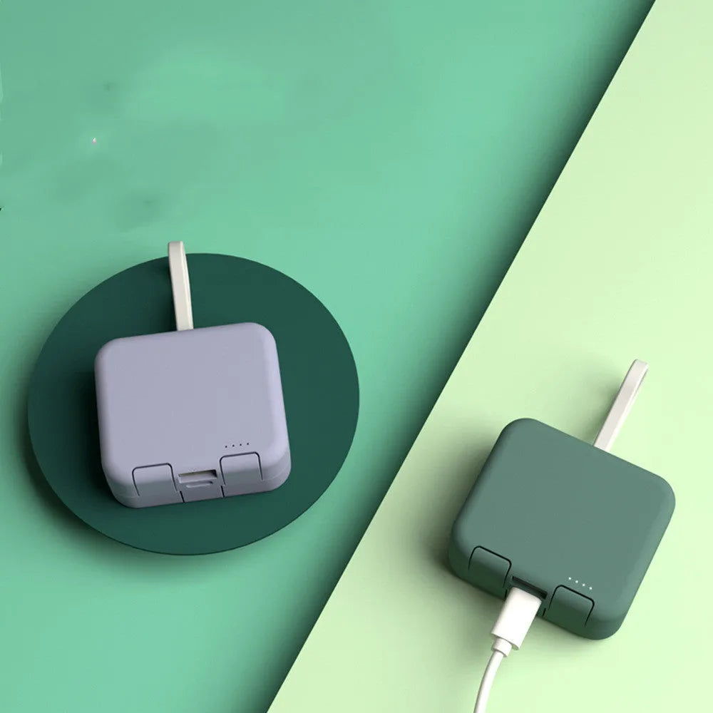Handbag back clip power bank in blue, showing clip, phone stand function, and Type-C charging ports.
