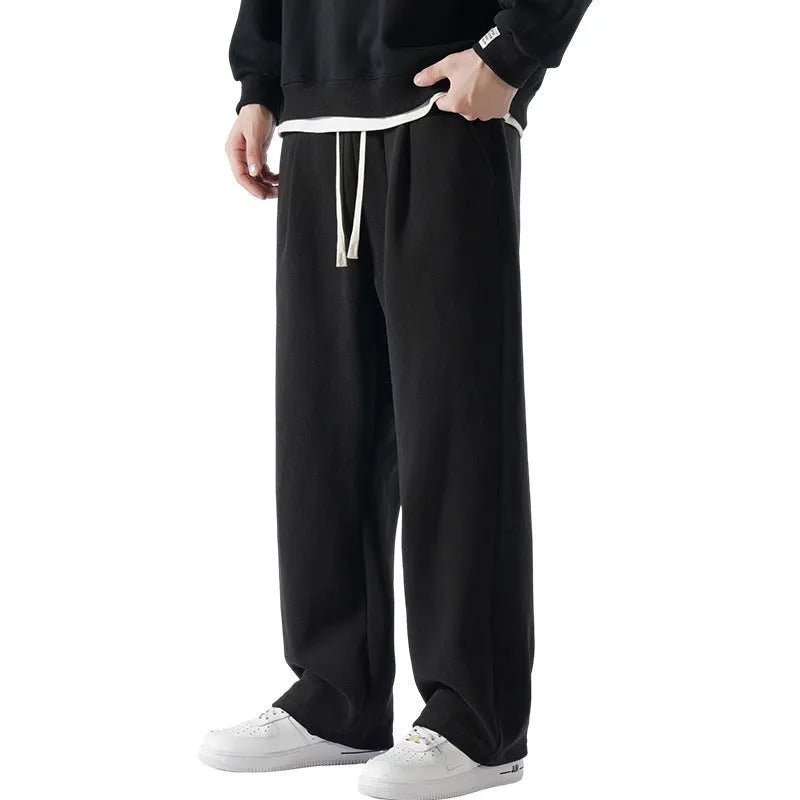 Men's apricot double-sided polar fleece casual trousers with a drawstring waistband, shown laid flat.