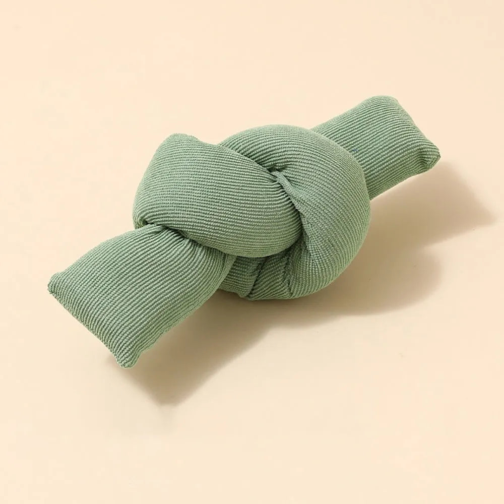 White knotted cotton rope dog toy for chewing and tug-of-war play.