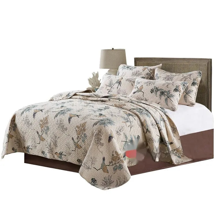 Quilted pure cotton bed cover set with printed design, includes bedspread and two pillowcases.