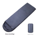 Navy blue envelope-style adult sleeping bag for camping with hollow cotton fibre filler.