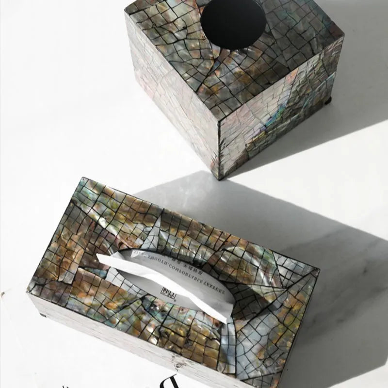 Black square and rectangular natural shell tissue boxes with removable storage organisers.