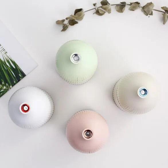 White ultrasonic aromatherapy diffuser humidifier with LED light and 300ml water bottle.