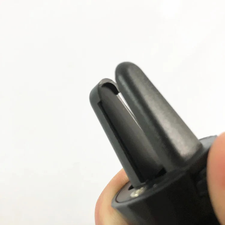 Glory black car phone holder mounted on a vehicle air vent holding a smartphone