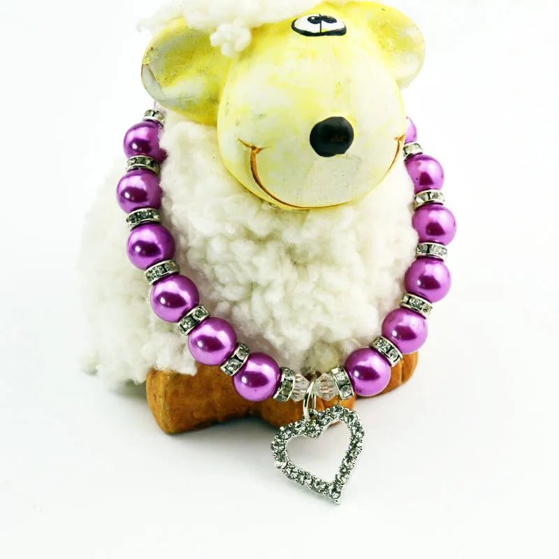 Pet pearl necklace with 10mm imitation pearls, 7mm rhinestone beads, alloy pendant, and white plated K detail