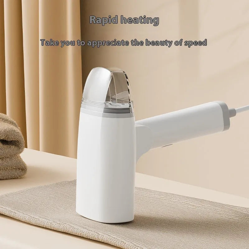 Blue handheld garment steamer with mechanical controls and compact design for portable clothes care