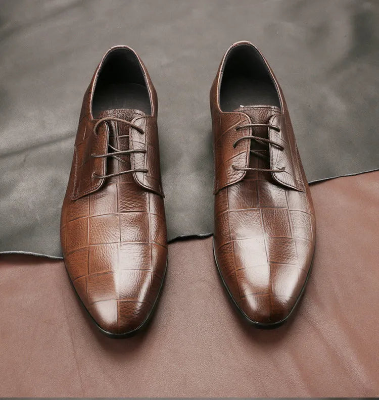 Men's black leather derby shoes with pointed toe, checkered sewing detail, and a rubber sole.