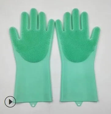 Blue silicone cleaning gloves with textured scrubbing surface on palms for washing dishes