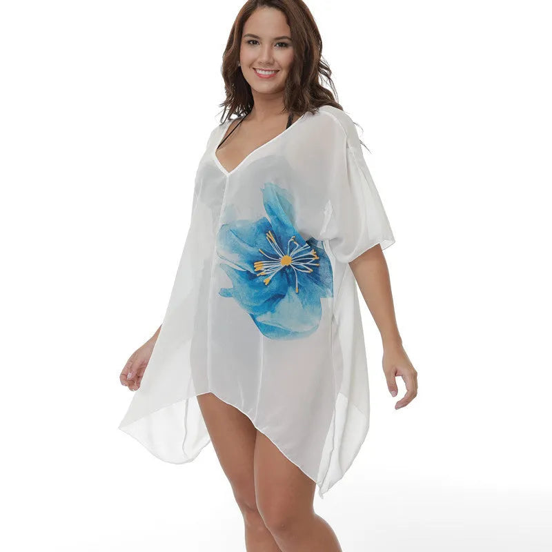 White plus size loose beach cover-up blouse on a hanger.