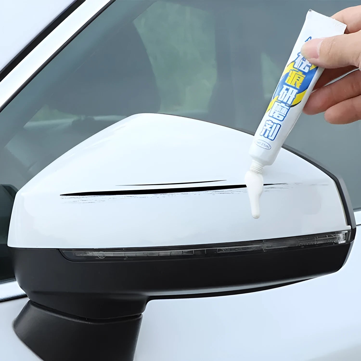 Automotive paint repair pen kit with touch-up paint, rubbing compound, sponge applicator, and sandpaper for car scratch repair