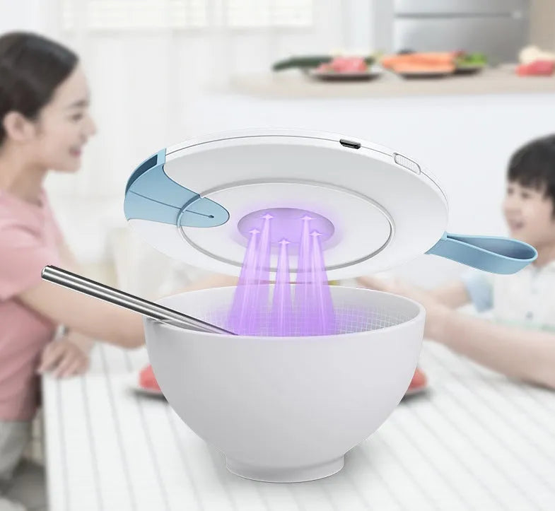 Blue portable baby bottle steriliser with USB cable, showing compact slim design.