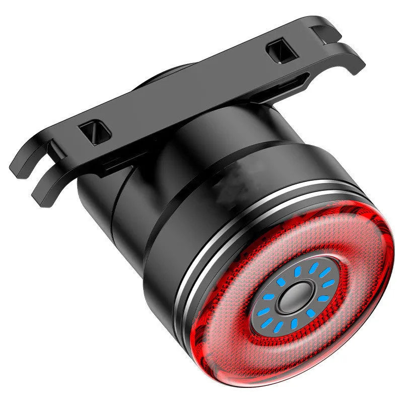 Black aluminium alloy smart brake sensing USB charging taillight for bicycles.