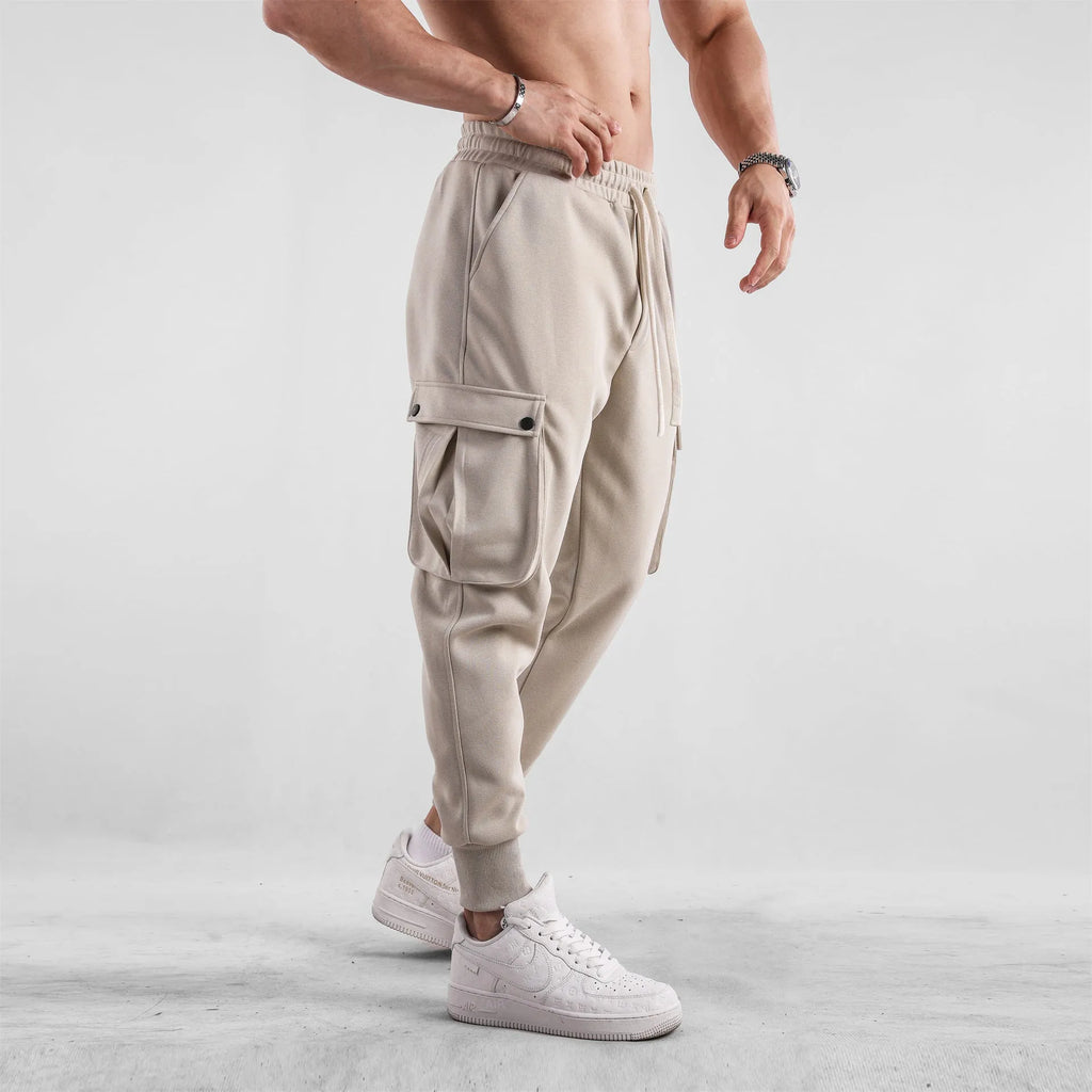Men's loose cotton sports trousers with ankle-tied cuffs and multiple pockets in various colour options
