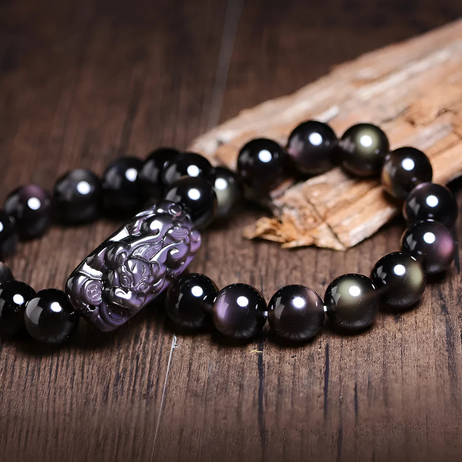 Crystal natural icy obsidian Pi Xiu bracelet with geometric ethnic design on wrist