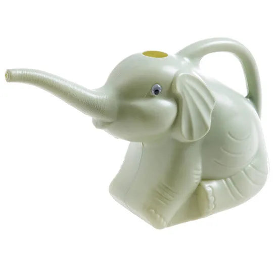 Pink baby elephant-shaped watering can with a long spout and baby bottle handle on a table.