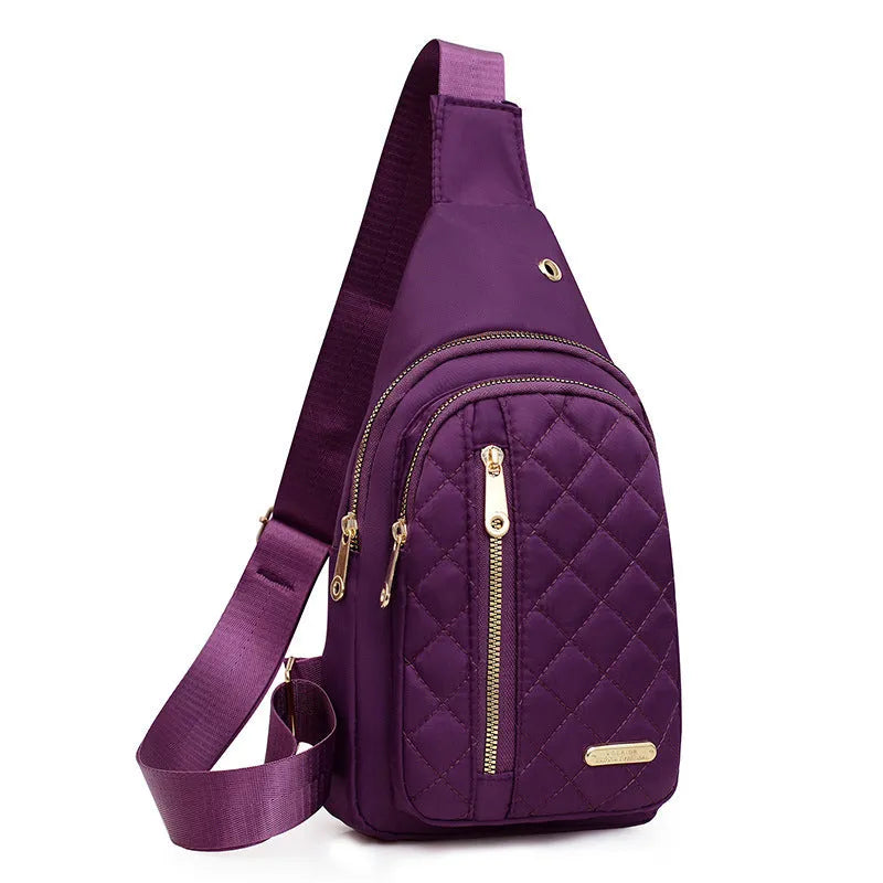 A girl's crossbody sports chest bag in Oxford cloth, shown in a choice of colours including black, dark blue, red, purple, and pink.