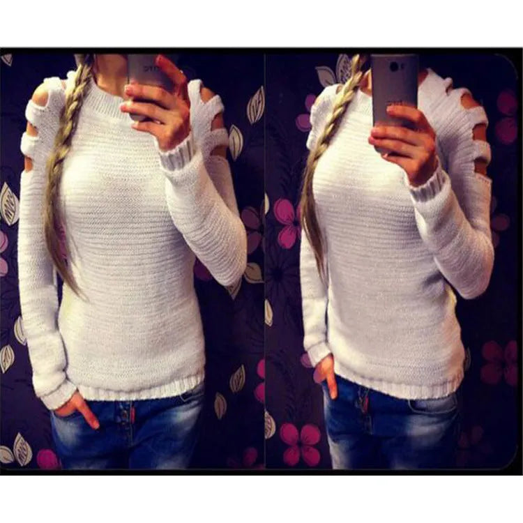 Women's grey hollow out knitted pullover top with round neck and long sleeves laid flat.