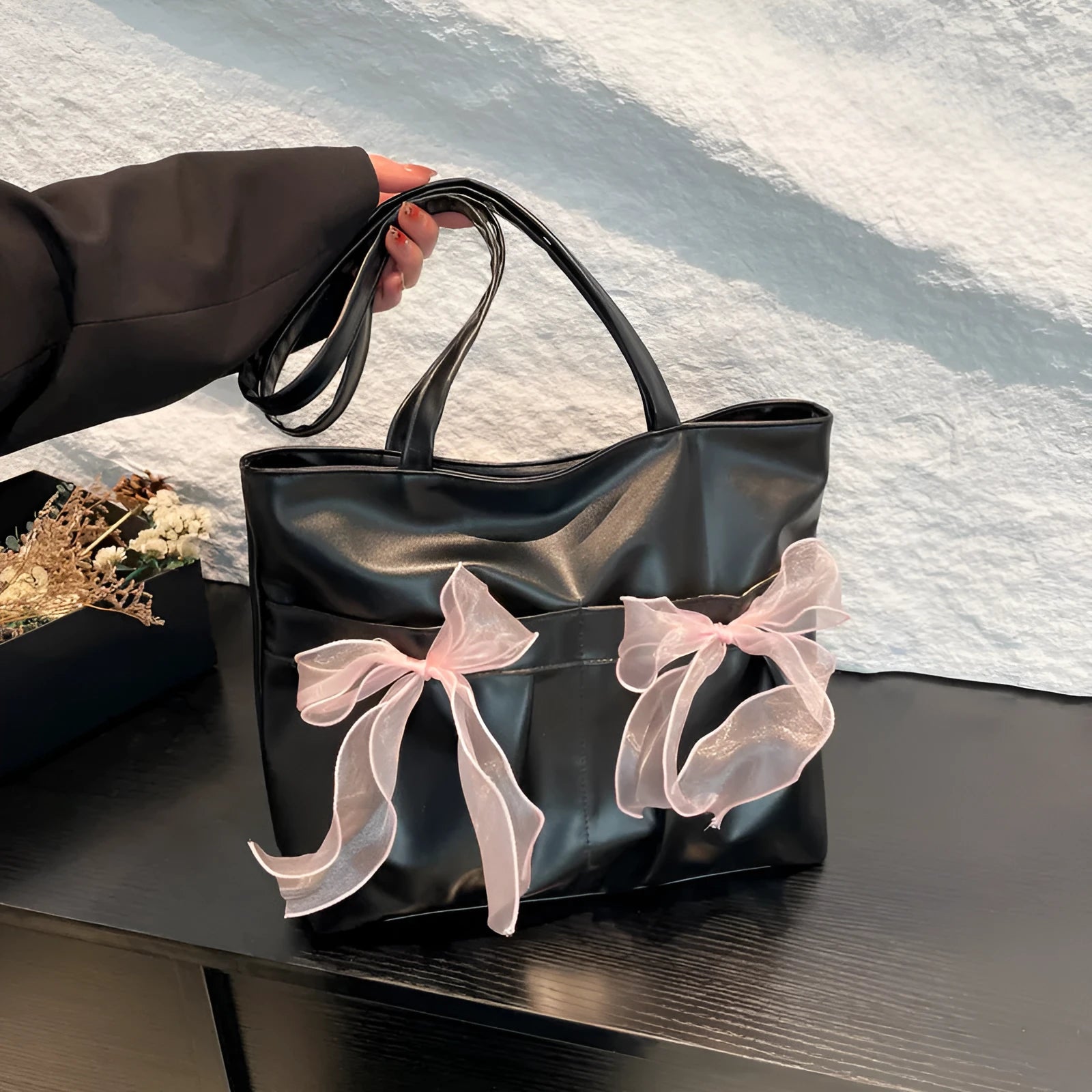 College style bow tote bag in black with double shoulder straps and large capacity design