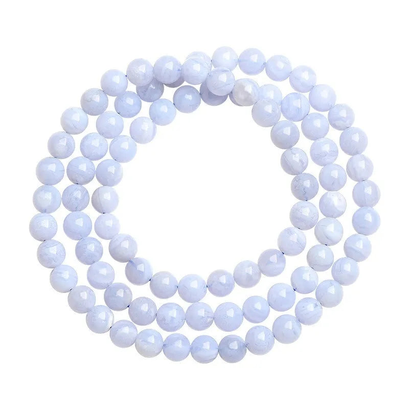 Close-up of a blue multi-circle patterned agate bead bracelet with 6-6.8mm beads and ruyi decorative elements.