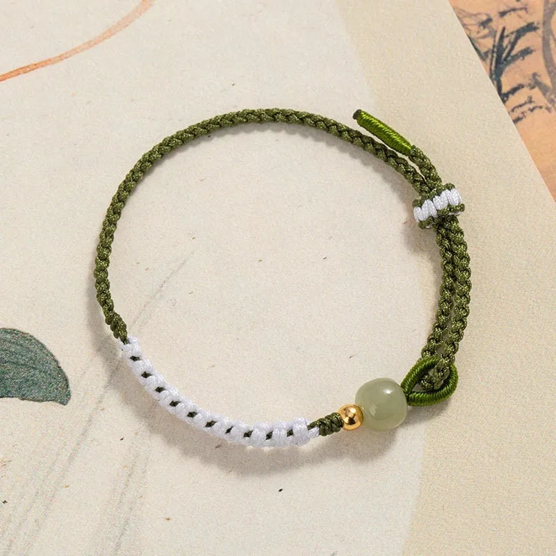 Hetian jade bracelet with sterling silver carrying strap on cord band in national fashion style