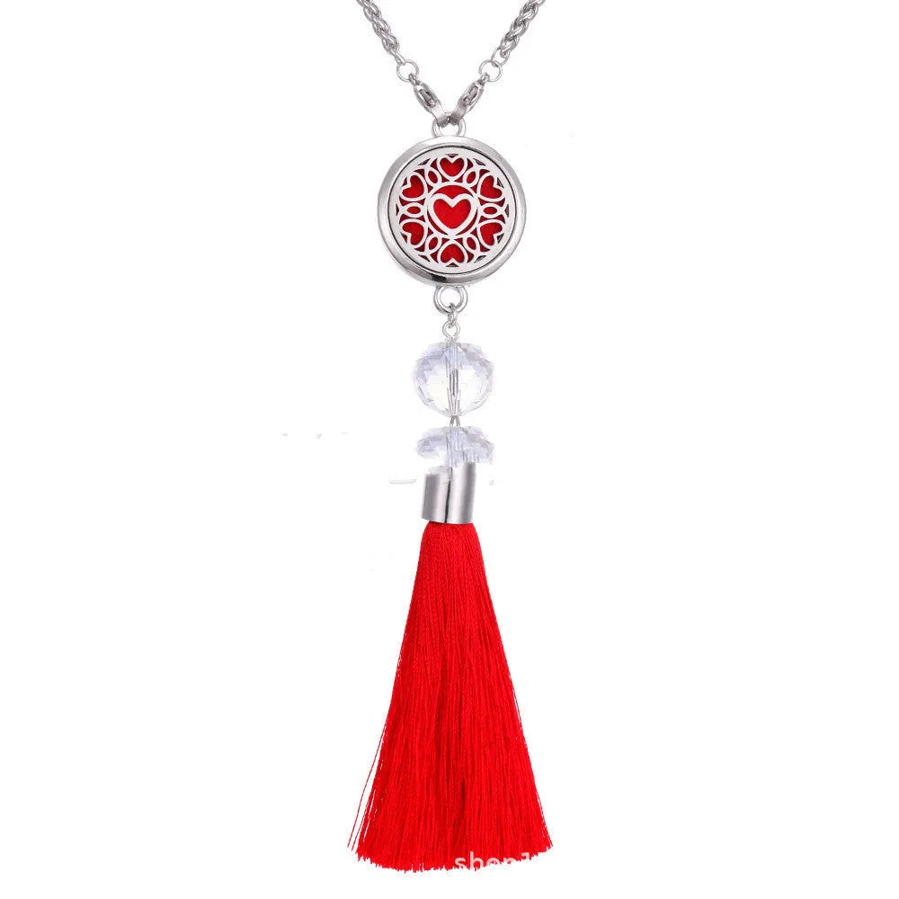 Alloy tassel car pendant with long chain hanging, showing decorative box detail.