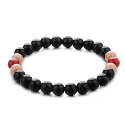 Natural stone lava bead bracelet with charms measuring 18cm in ethnic style