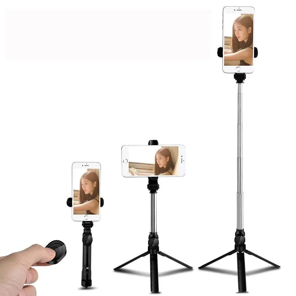 Apple-compatible black tripod selfie stand with Bluetooth remote and 360-degree rotating phone clip extended.