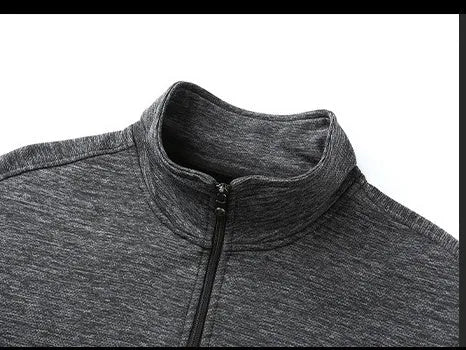 Men's black athletic fit casual jacket with a stand-up collar and front zip closure on a hanger.