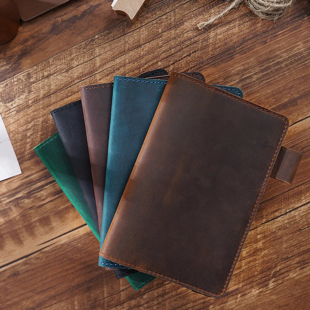 Handmade cowhide kraft notebook open showing wood-free paper with dark green cover option
