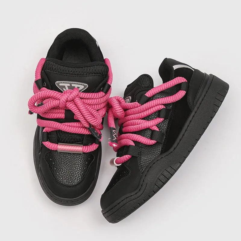 Low-top lace-up casual sneakers in denim blue with a round toe and thick rubber sole.