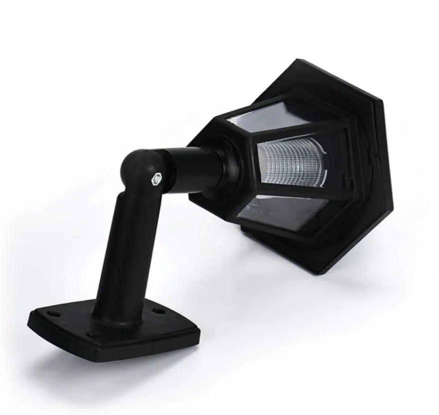 Black hexagonal solar wall lamp for outdoor garden or patio mounting