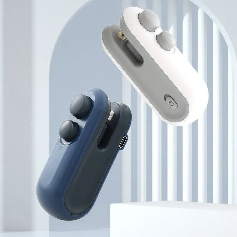 Handheld white vacuum sealer with cutter blade and magnetic back for bag sealing