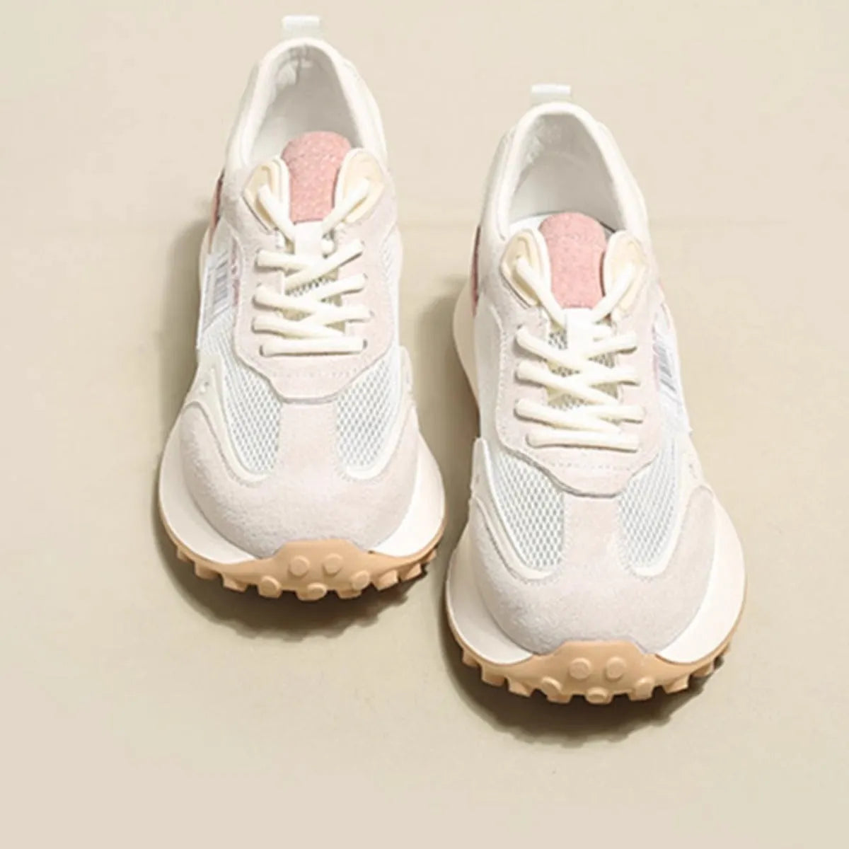 Women's grey and pink retro sneakers with low top design and rubber sole