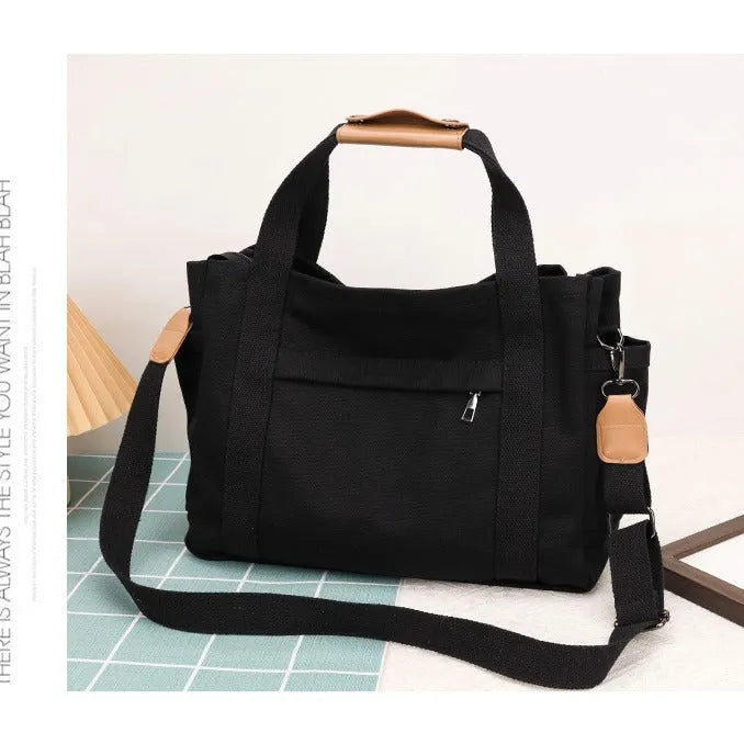 Women's large capacity canvas tote bag with multiple internal pockets in horizontal square design