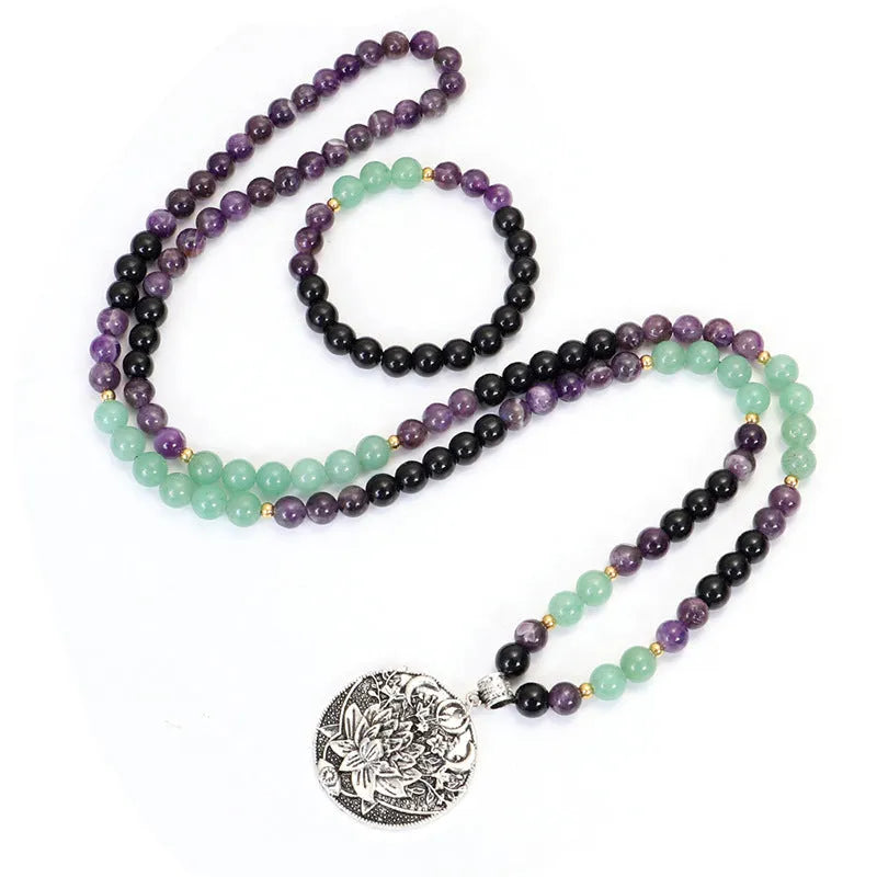 Geometric lotus pendant yoga necklace with stone bead chain and matching bracelet on white background