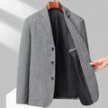 Men's loose fit solid colour woolen coat in black, shown on a model for casual autumn wear.