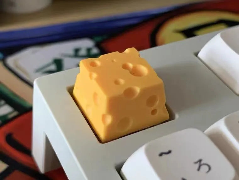Resin cheese key cap for mechanical keyboards with yellow decorative cheese wedge design