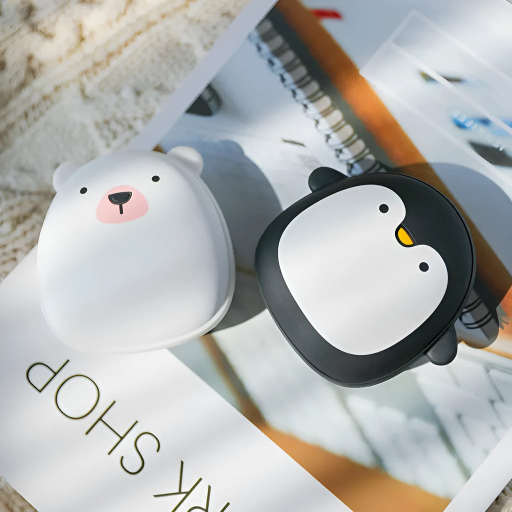 USB rechargeable electric hand warmer with penguin polar bear design showing front and back heating surfaces