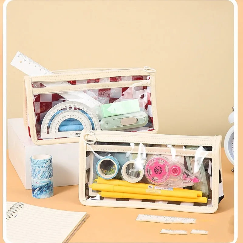 Transparent PVC pencil case with chessboard grid design showing pens inside, black and white plaid pattern