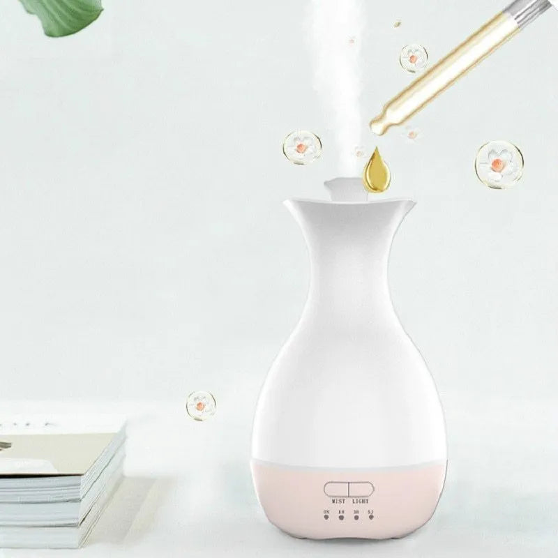 White ultrasonic aromatherapy diffuser with colourful LED light misting essential oils