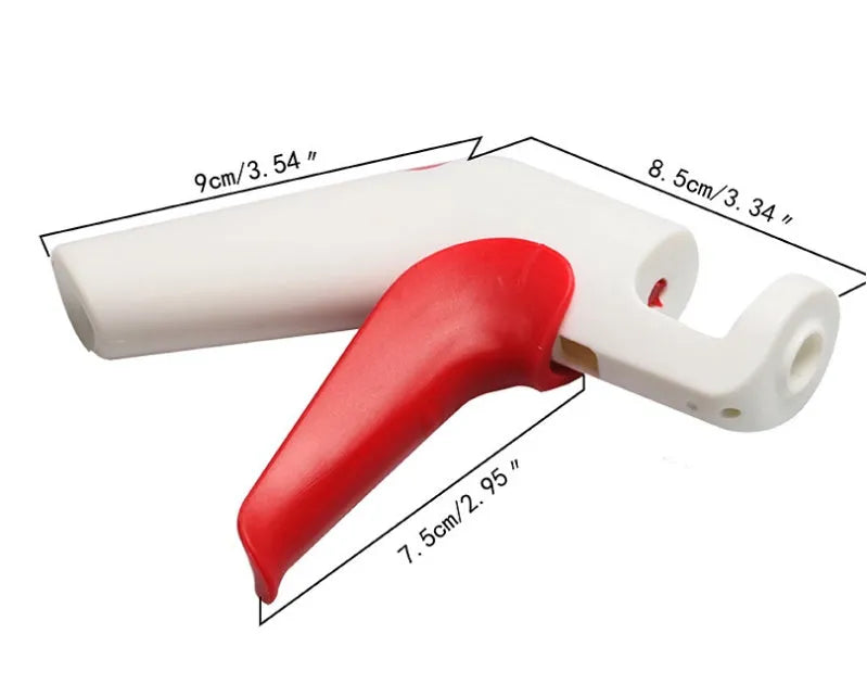Stainless steel cherry pitter kitchen gadget with soft grip handles for removing stones from fruit.