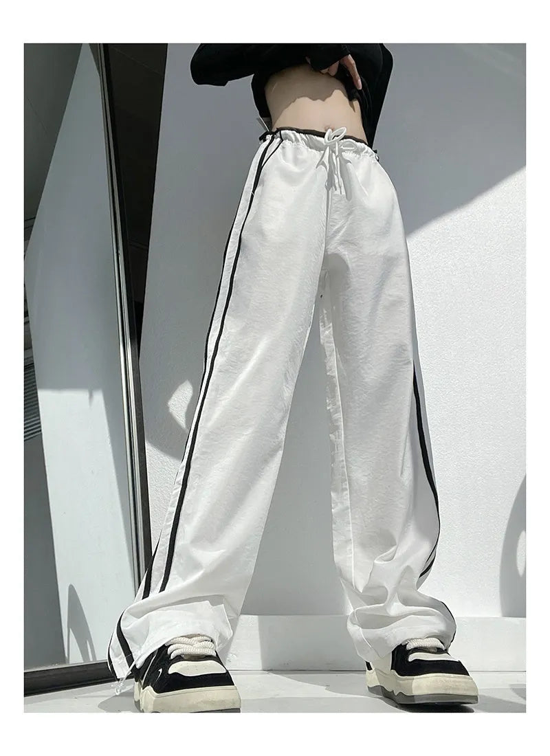 Women's slim drape trousers with contrast ribbon parallel bars detailing and loose straight leg cut