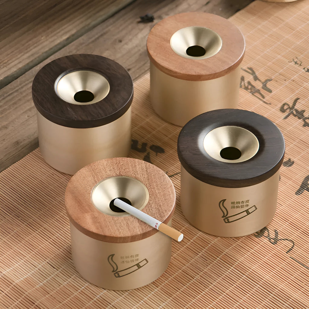 Brass ashtray with wooden lid featuring centre hole design