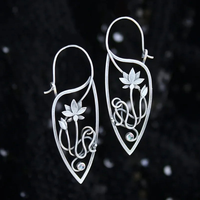 Silver lotus vine rhinestone earrings with geometric floral design