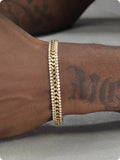 Gold-coloured unisex tennis bracelet made from titanium steel with inlaid artificial gemstones.