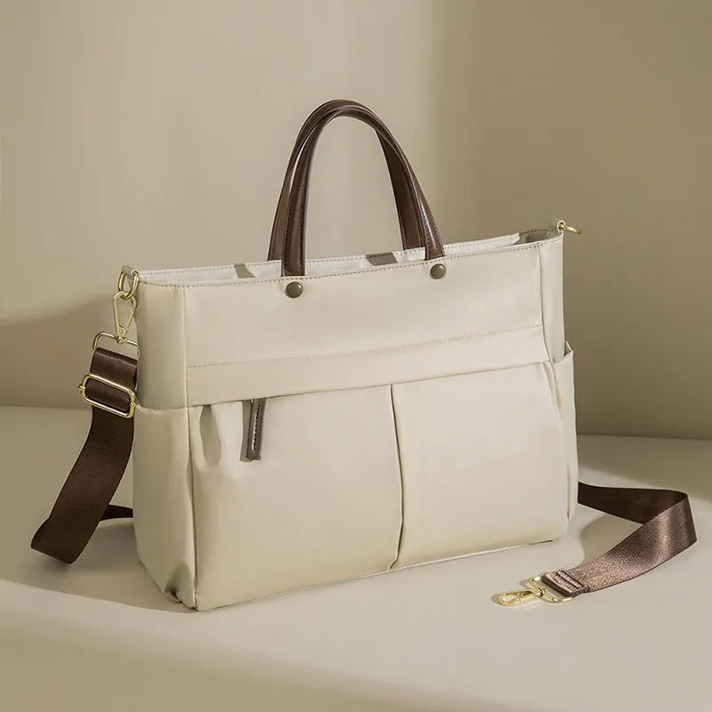 Women's oxford cloth laptop briefcase in elegant black showing open pocket and stitching detail