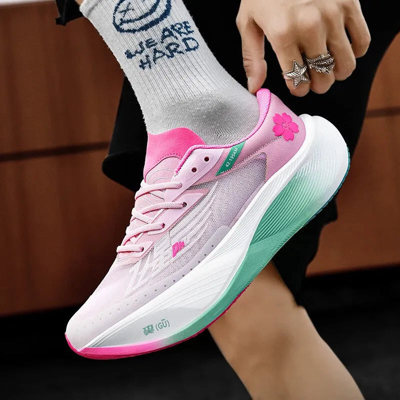 Low-top carbon plate racing sneakers in multiple colours with front lace-up and natural rubber sole.