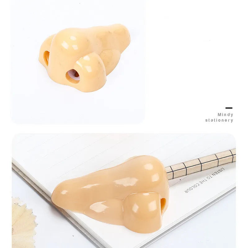 Flesh-coloured plastic pencil sharpener with dual holes for different pencil sizes