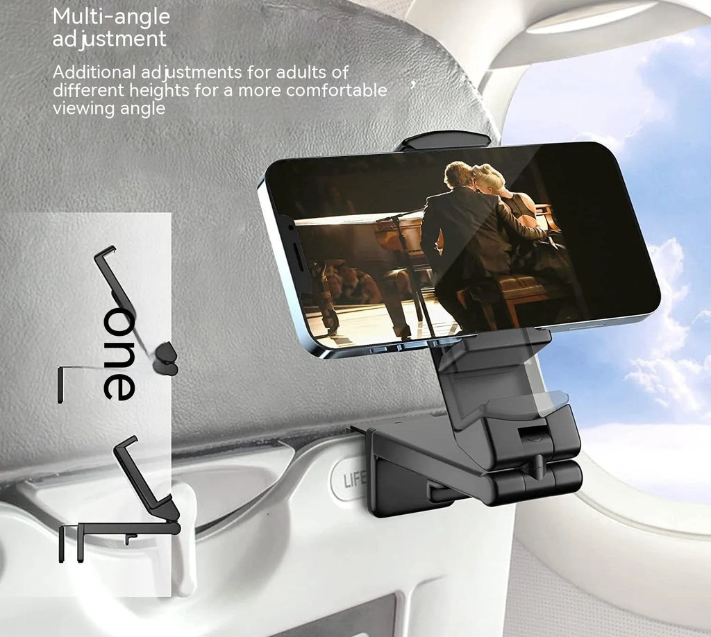 Black foldable rotating phone stand holding a mobile phone in landscape orientation on a desk.