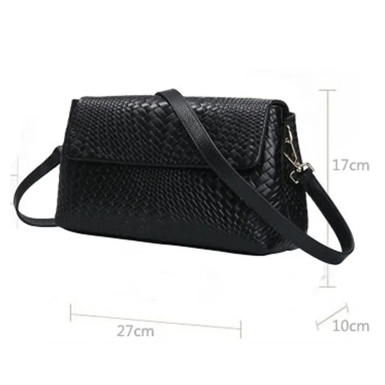 Black genuine leather woven crossbody bag with embossed finish, soft carry handle, and single shoulder strap.